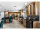 Modern kitchen with stainless steel appliances, black countertops, and beautiful custom cabinetry at 961 Leisure World --, Mesa, AZ 85206