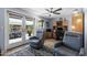 Bright home office with a ceiling fan, desk, and patio access at 961 Leisure World --, Mesa, AZ 85206