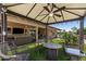 Outdoor patio with ceiling fan, string lights, comfortable seating, and a fire pit for relaxing evenings at 961 Leisure World --, Mesa, AZ 85206
