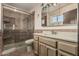 Cozy bathroom features tiled walk-in shower and single sink vanity at 1010 E Buena Vista Dr, Tempe, AZ 85284