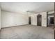 Spacious bedroom with carpet flooring, and a view of an open doorway at 1010 E Buena Vista Dr, Tempe, AZ 85284