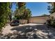 Home featuring a detached garage, extra parking, and a secure backyard at 1010 E Buena Vista Dr, Tempe, AZ 85284