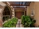 Inviting entrance featuring unique architectural design, decorative lighting, and desert landscaping at 1010 E Buena Vista Dr, Tempe, AZ 85284