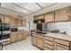 Kitchen with ample cabinet space, and a flat cooktop on the center island at 1010 E Buena Vista Dr, Tempe, AZ 85284
