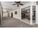 Spacious living room with large windows and an open kitchen layout at 1010 E Buena Vista Dr, Tempe, AZ 85284