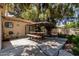 Outdoor patio area with picnic table, shade, and mature trees at 1010 E Buena Vista Dr, Tempe, AZ 85284
