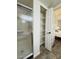 Bathroom closet space, featuring wire shelving, with bedroom in the background at 10330 W Thunderbird Blvd # C206, Sun City, AZ 85351