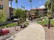 Community courtyard features walkways and green spaces with lush landscaping at 10330 W Thunderbird Blvd # C206, Sun City, AZ 85351