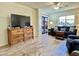 Inviting living room with comfortable seating, TV, and a balcony at 10330 W Thunderbird Blvd # C206, Sun City, AZ 85351
