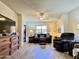 Bright living room with neutral tones, fan and comfortable sofa at 10330 W Thunderbird Blvd # C206, Sun City, AZ 85351