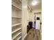 Spacious walk-in closet with built-in shelving and ample storage for luggage and personal items at 10330 W Thunderbird Blvd # C206, Sun City, AZ 85351