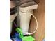 This image shows a water filter underneath the sink at 10330 W Thunderbird Blvd # C206, Sun City, AZ 85351