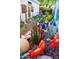 Scenic backyard with a rock pathway lined with metal troughs of eclectic art and colorful plantings at 10449 E Jacob Ave, Mesa, AZ 85209