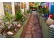 Sprawling backyard featuring unique garden beds, art, rock paths, and an outdoor seating area at 10449 E Jacob Ave, Mesa, AZ 85209