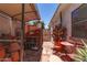 Cozy backyard featuring a charming patio set, a potting station and a rock garden at 10449 E Jacob Ave, Mesa, AZ 85209