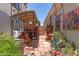 View of the backyard featuring a covered patio, a small garden and a rock pathway at 10449 E Jacob Ave, Mesa, AZ 85209