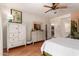 Bedroom with a white dresser and access to an ensuite bathroom and closet, providing convenience and style at 10449 E Jacob Ave, Mesa, AZ 85209