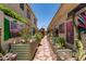 Beautifully landscaped courtyard with stone pathway and vibrant art at 10449 E Jacob Ave, Mesa, AZ 85209