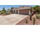 Inviting single-story home with desert landscaping and a convenient two-car garage at 10449 E Jacob Ave, Mesa, AZ 85209