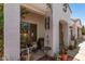 Charming front porch adorned with potted plants, creating an inviting entrance to the home at 10449 E Jacob Ave, Mesa, AZ 85209