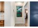 Hallway features decorative painting and leads to bedroom, showcasing the home's cohesive design at 10449 E Jacob Ave, Mesa, AZ 85209