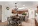 Bright kitchen with a dining table, chandelier, and ample wood cabinetry at 10449 E Jacob Ave, Mesa, AZ 85209