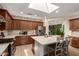 Bright and airy kitchen with stainless steel appliances, a center island, and pendant lighting at 10449 E Jacob Ave, Mesa, AZ 85209