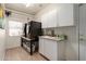 Efficient laundry room with modern washer and dryer, sink, and cabinets for easy chores at 10449 E Jacob Ave, Mesa, AZ 85209