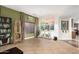 Bright living room featuring tile floors, neutral walls, and curated decor elements at 10449 E Jacob Ave, Mesa, AZ 85209