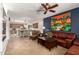 Open floor plan with living room flowing into the kitchen, featuring a large kitchen island and dining area at 10449 E Jacob Ave, Mesa, AZ 85209