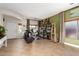 Spacious home office area showcasing an art easel, shelves of books, and natural light at 10449 E Jacob Ave, Mesa, AZ 85209