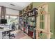 Inviting home office area featuring a bookshelf, comfortable seating, and lots of natural light at 10449 E Jacob Ave, Mesa, AZ 85209