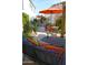 Charming patio setting with colorful pillows and a cozy outdoor lounge at 10449 E Jacob Ave, Mesa, AZ 85209