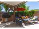 Comfortable outdoor seating area with an umbrella for shade at 10449 E Jacob Ave, Mesa, AZ 85209