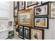 Charming powder room adorned with an eclectic gallery wall of art, adding personality and charm at 10449 E Jacob Ave, Mesa, AZ 85209