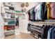 Organized walk-in closet featuring shelving, hanging rods, and shoe storage for optimal wardrobe management at 10449 E Jacob Ave, Mesa, AZ 85209