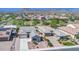 An aerial view of the houses and the neighborhood, featuring desert landscaping and tiled roofs at 10664 E Ellis St, Mesa, AZ 85207