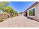 Spacious paver patio featuring an outdoor grill, and an outdoor fireplace, and perimeter landscaping at 10664 E Ellis St, Mesa, AZ 85207