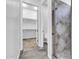 En-suite bathroom featuring shower, toilet room, and walk-in closet at 10664 E Ellis St, Mesa, AZ 85207