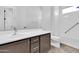 Neutral bathroom featuring brown vanity, white fixtures, and white tiling at 10664 E Ellis St, Mesa, AZ 85207