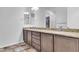 Bathroom vanity with dual sinks, granite countertops, and ample cabinet space at 10664 E Ellis St, Mesa, AZ 85207
