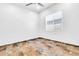Well-lit bedroom with tiled floors, neutral walls, and a bright window at 10664 E Ellis St, Mesa, AZ 85207