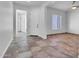 Inviting entryway featuring tile floors, neutral walls, and a bright white front door at 10664 E Ellis St, Mesa, AZ 85207