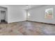 Open-concept living room featuring tile floors, neutral walls, and recessed lighting at 10664 E Ellis St, Mesa, AZ 85207