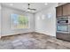 Bright living room with large windows, tiled flooring, and modern stainless steel appliances at 10664 E Ellis St, Mesa, AZ 85207