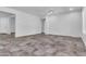 Open-concept living room with neutral walls, tile floors, and recessed lighting at 10664 E Ellis St, Mesa, AZ 85207