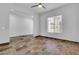 Bright and airy living room with tile floors, a ceiling fan, and large windows for natural light at 10664 E Ellis St, Mesa, AZ 85207