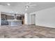 Open-concept living space featuring tile floors, recessed lighting, and a seamless flow to the kitchen at 10664 E Ellis St, Mesa, AZ 85207
