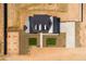 Aerial top-down view of a modern home with dark metal roof, square patches of green grass, and a paved driveway at 11564 E Windsor Way, Florence, AZ 85132