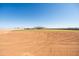 Lot in a new home construction area with dirt area and grassy part around the home at 11564 E Windsor Way, Florence, AZ 85132